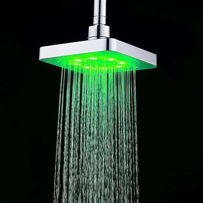 a shower head with green light coming out of it